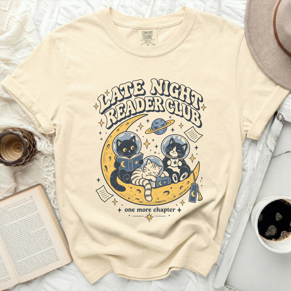 Cream t-shirt with "Late Night Reader Club" and cats reading on the moon.