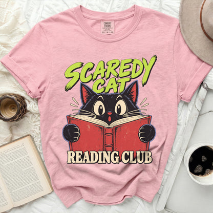 Pink t-shirt with black cat reading a book and text "Scaredy Cat Reading Club".