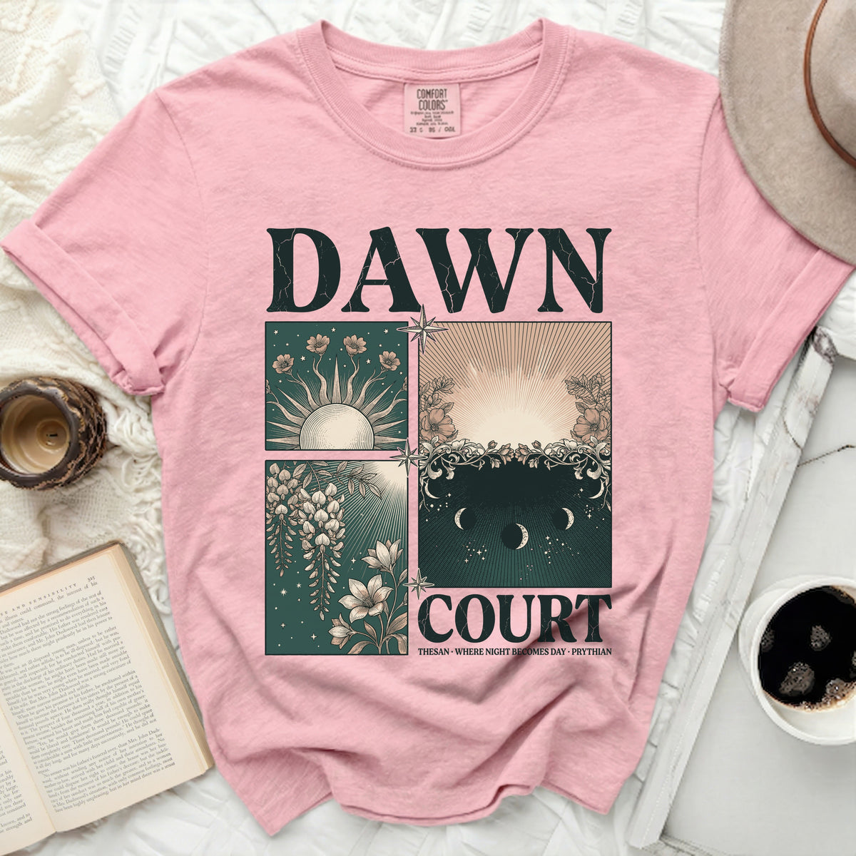 Pink t-shirt with "DAWN COURT" and celestial-themed graphics.