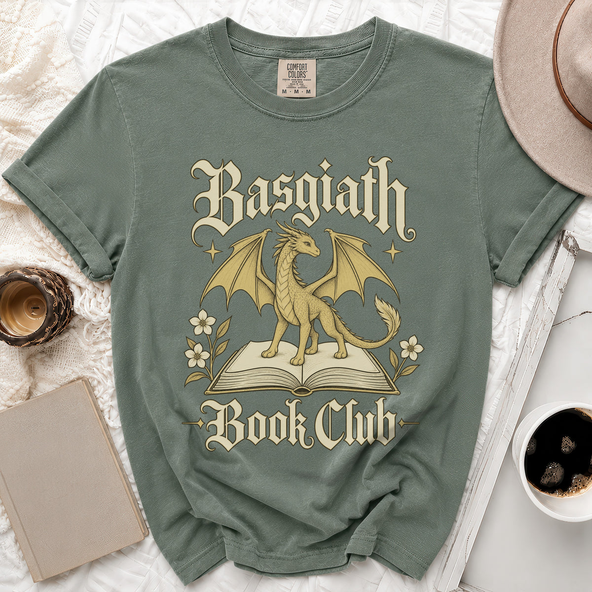 Green t-shirt with a gold dragon on an open book, reading "Basgiath Book Club."