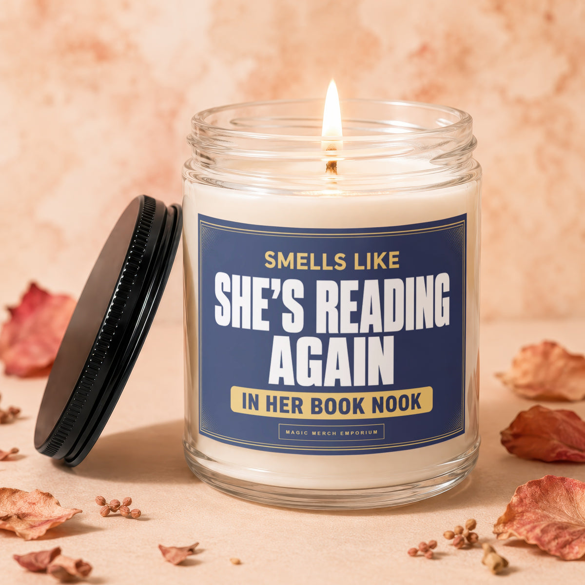 Scented candle with text "Smells like she's reading again in her book nook".