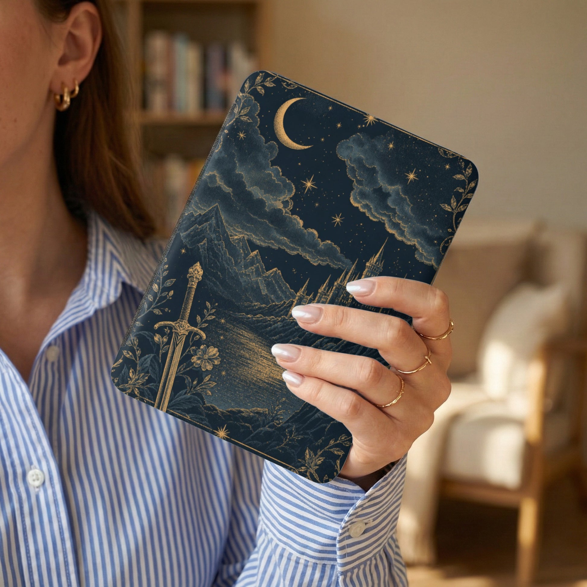 Dark blue celestial design with sword, castle, mountains, and moon on a tablet case.