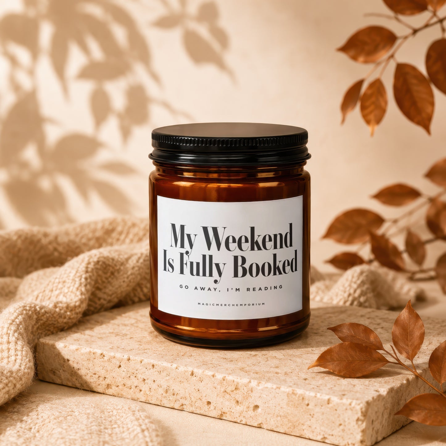 Candle with label "My Weekend Is Fully Booked Go Away, I'm Reading".