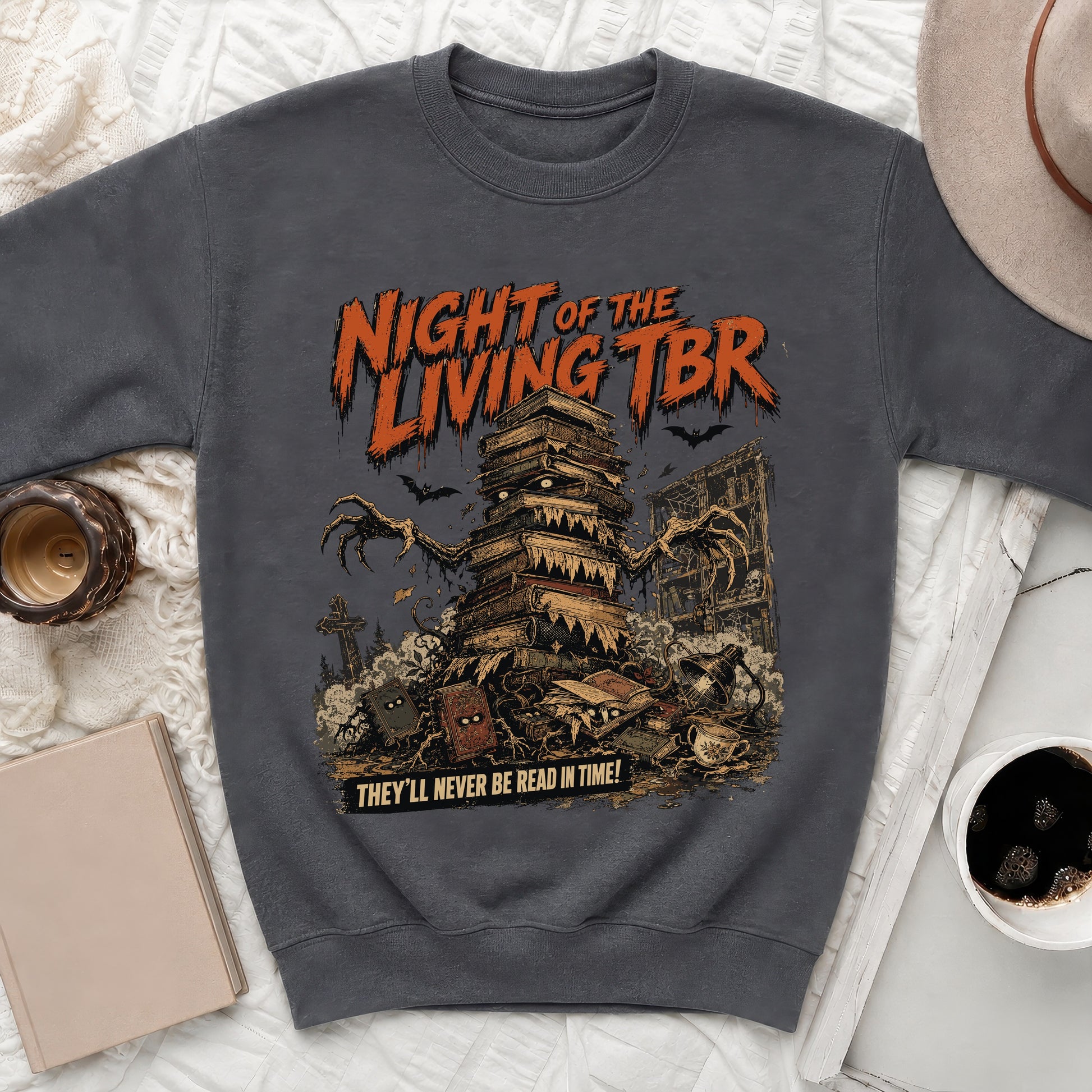 Crewneck sweatshirt with "Night of the Living TBR" and book monster graphic.