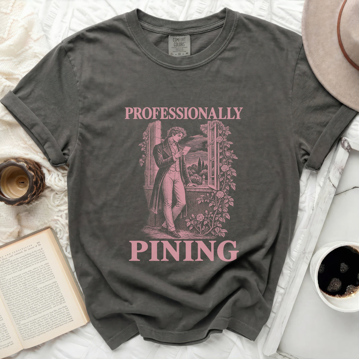 Dark gray t-shirt with pink text "PROFESSIONALLY PINING" and vintage graphic.