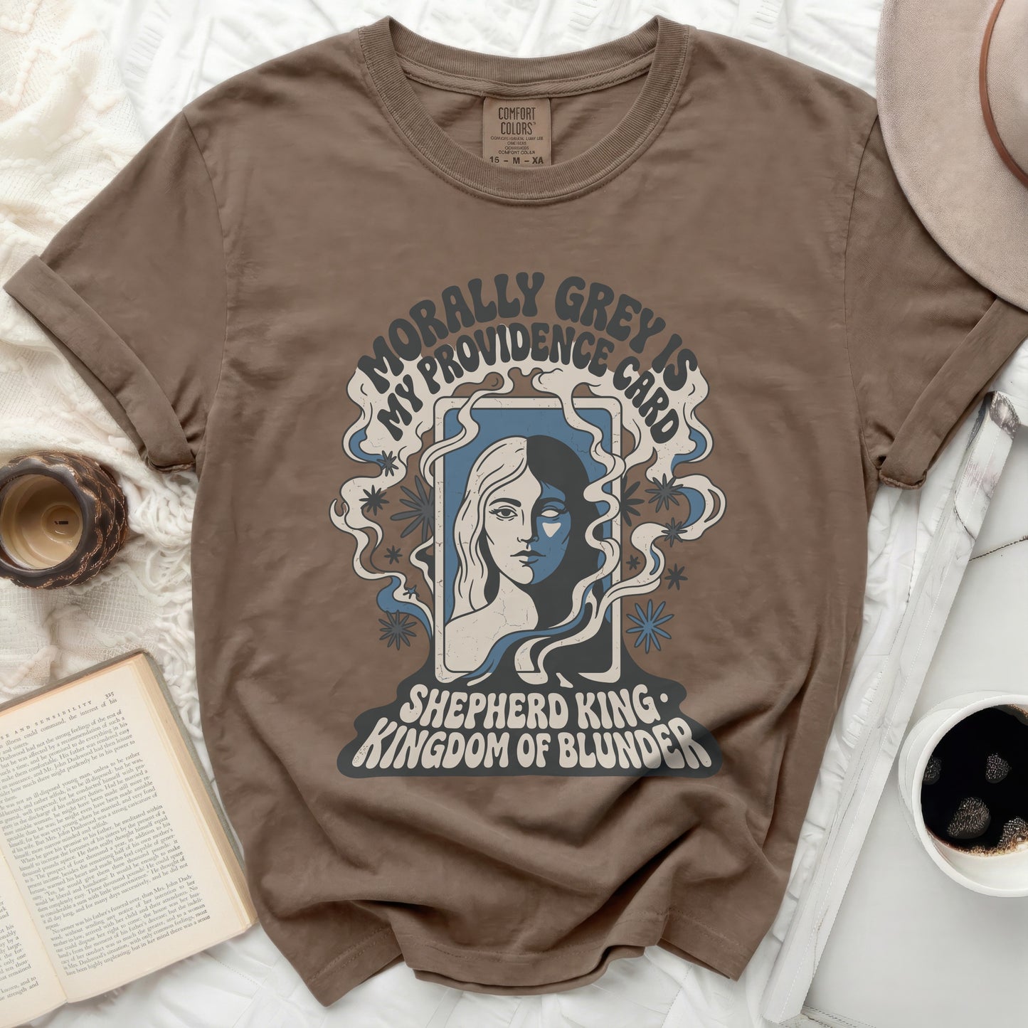 T-shirt with "Morally Grey is My Providence Card Shepherd King Kingdom of Blunder" text.