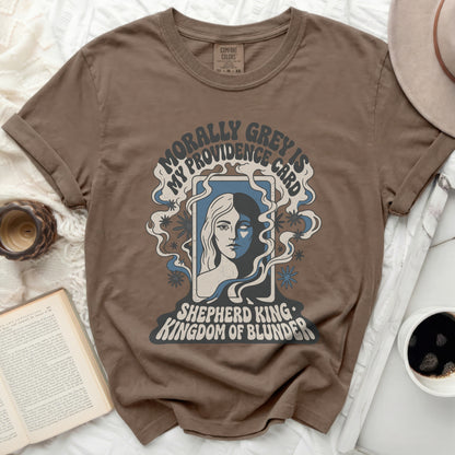 T-shirt with "Morally Grey is My Providence Card Shepherd King Kingdom of Blunder" text.