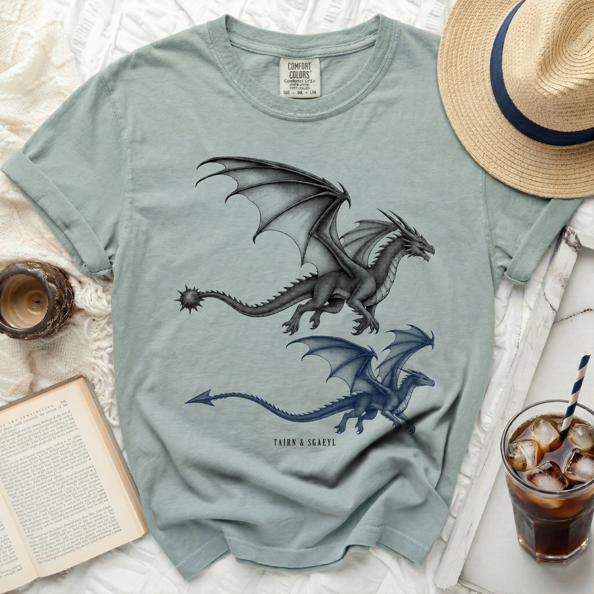 Pale green t-shirt with two dragons and text "TAIRN & SGAEYL".