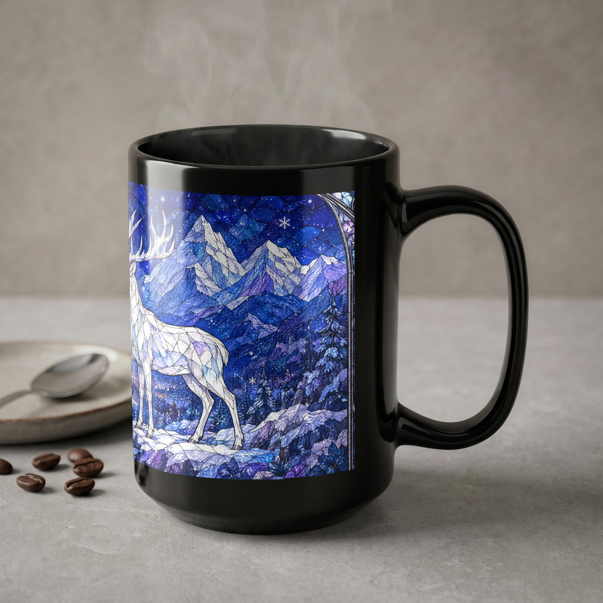 A black ceramic mug featuring a blue winter landscape with a white stag stands on a grey surface.