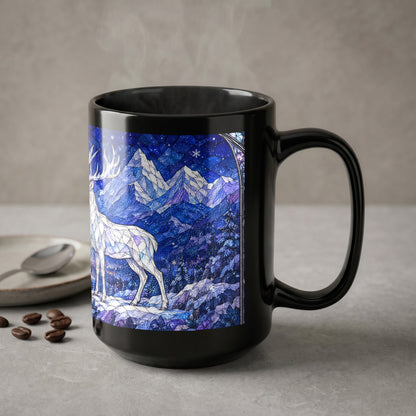 A black ceramic mug featuring a blue winter landscape with a white stag stands on a grey surface.