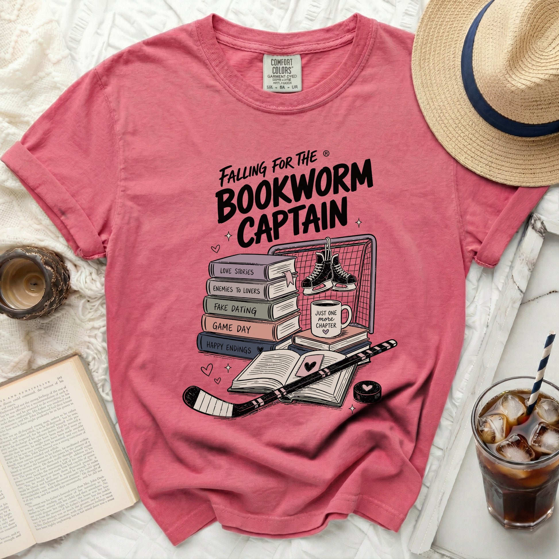 Pink t-shirt with "Falling for the Bookworm Captain" graphic.