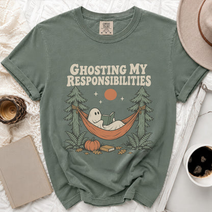 Ghosting My Responsibilities text on green t-shirt with a reading ghost in a hammock.