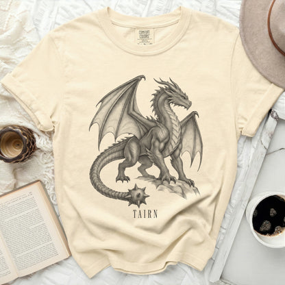 Light beige t-shirt with a graphite drawing of a dragon and the word "TAIRN".