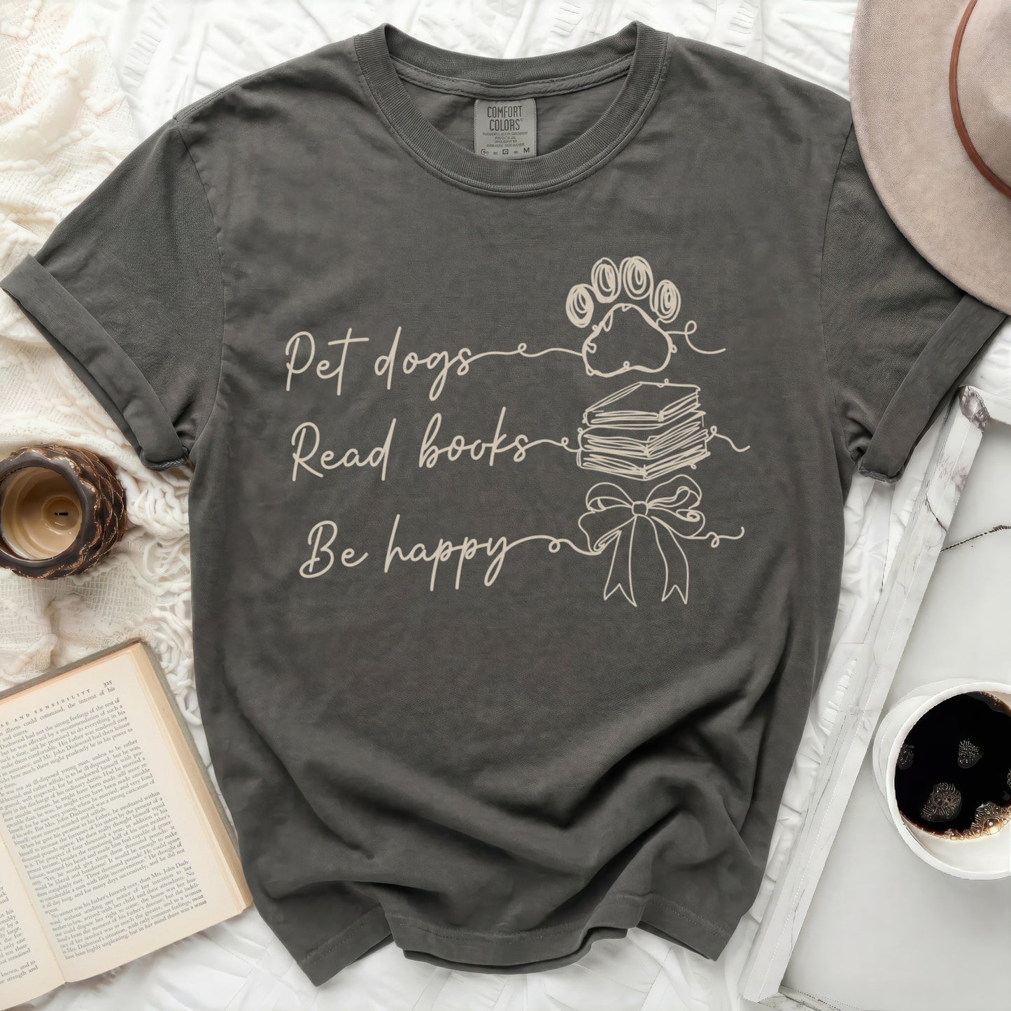 Dark gray t-shirt with "Pet dogs Read books Be happy" text and paw print.