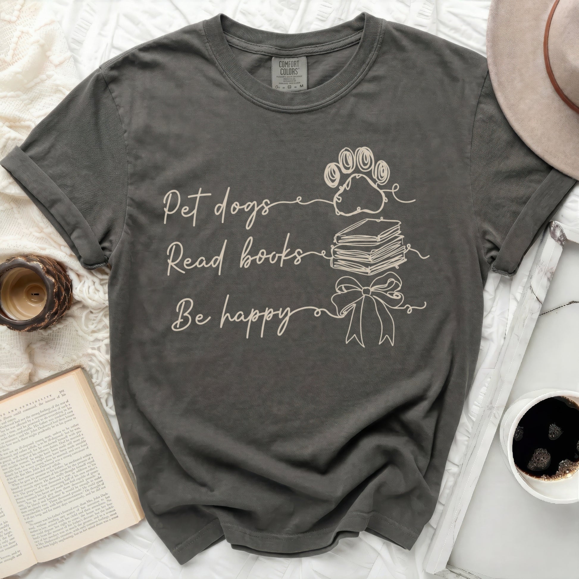 Dark gray t-shirt with "Pet dogs Read books Be happy" text and paw print.
