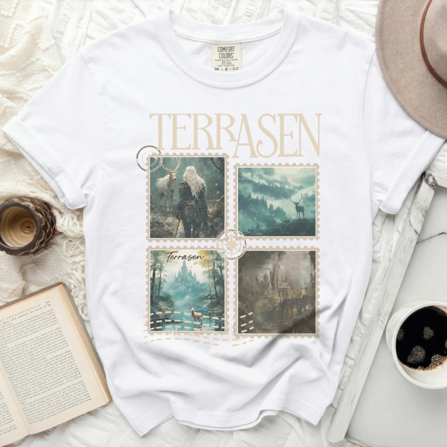 White t-shirt with four postage stamps featuring fantasy art and "Terrasen" text.
