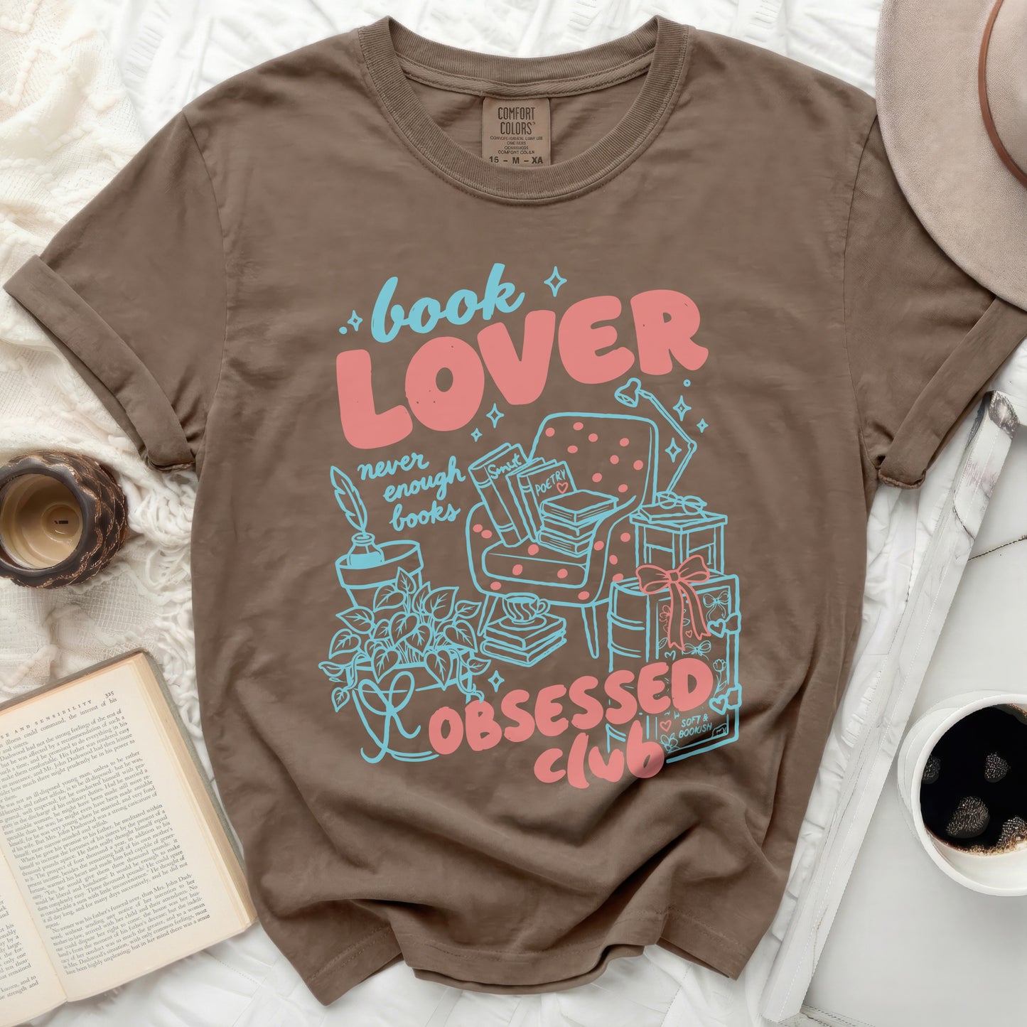 Brown t-shirt with "book LOVER never enough books OBSESSED club" graphic.