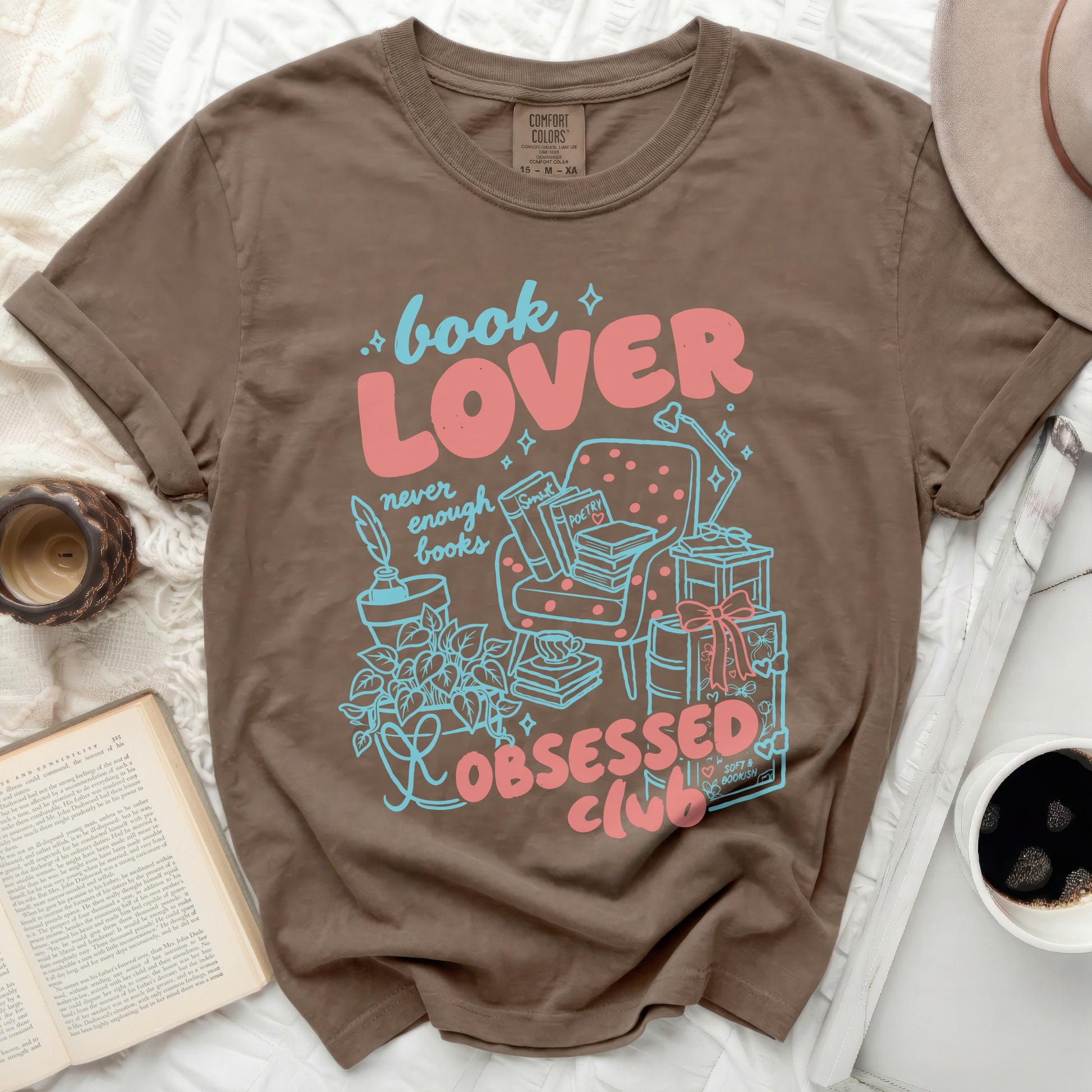 Brown t-shirt with "book LOVER never enough books OBSESSED club" graphic.