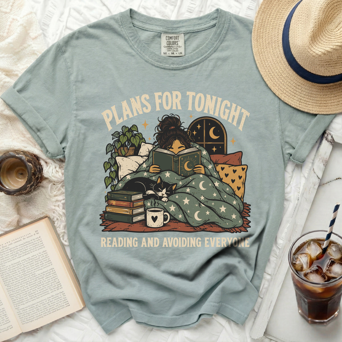 T-shirt with "Plans for tonight, reading and avoiding everyone" graphic.