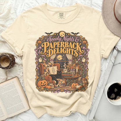 Cream t-shirt with "Spooky Nights & Paperback Delights" Halloween graphic.