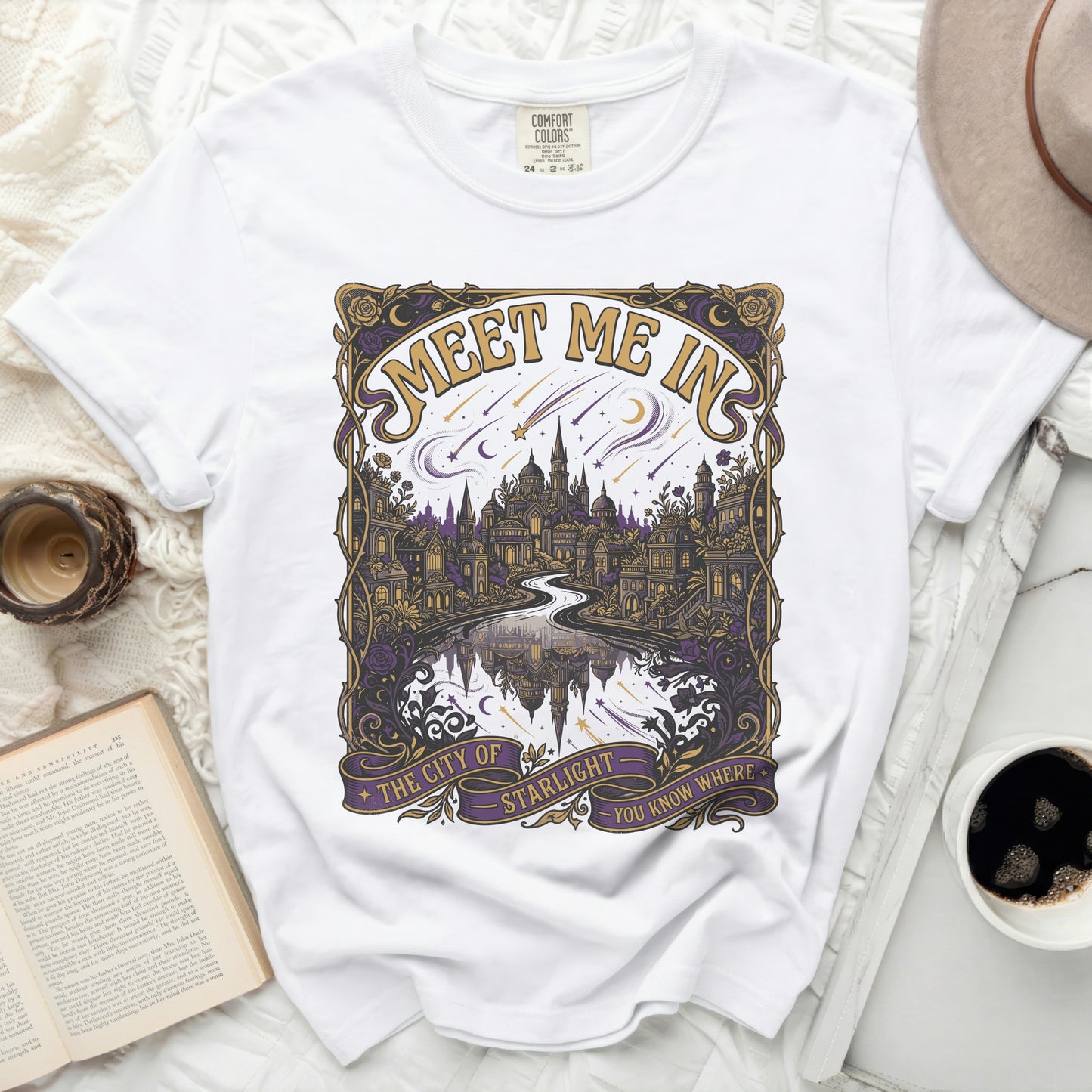 White t-shirt with vintage art of city, river, stars, and text "Meet Me In The City Of Starlight You Know Where".