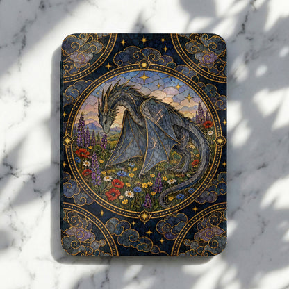 An e-reader case featuring an intricate stained-glass style illustration of a grey dragon in a flowery meadow.