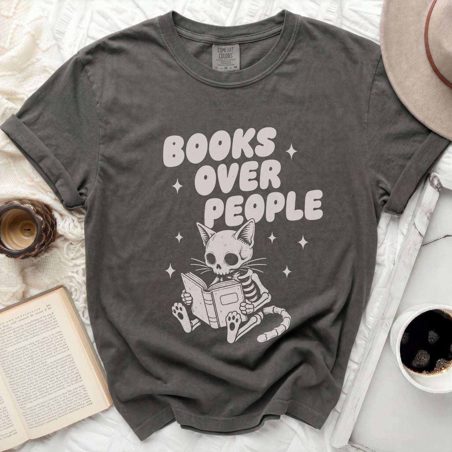 Dark grey t-shirt with skeletal cat reading "Books Over People".