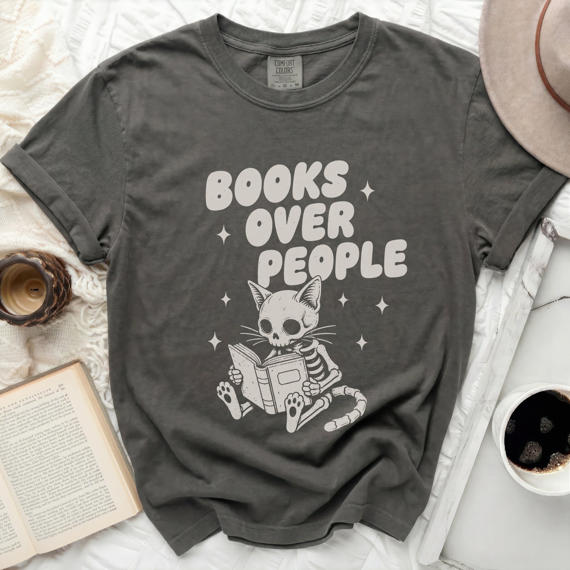Dark grey t-shirt with skeletal cat reading "Books Over People".