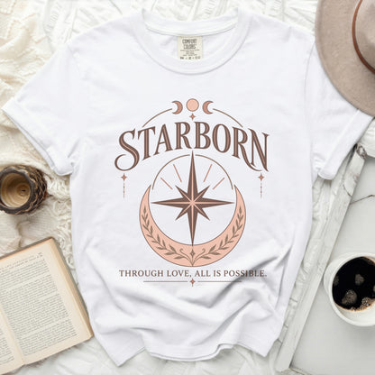 White Comfort Colors t-shirt with "STARBORN" and "THROUGH LOVE, ALL IS POSSIBLE." text.