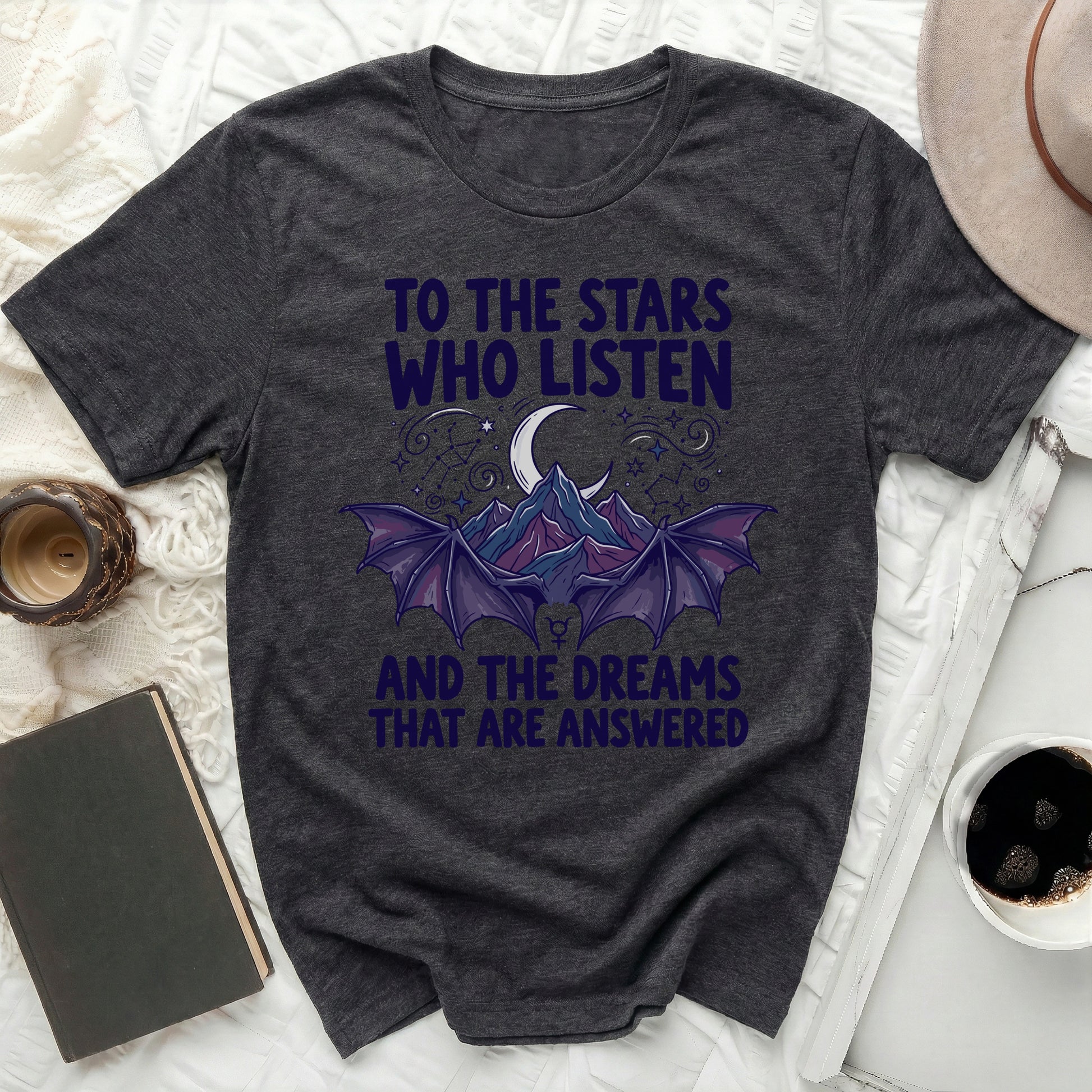 TO THE STARS WHO LISTEN AND THE DREAMS THAT ARE product type
Dark Grey T-shirt
Celestial Design
Moon Star Graphic
Bat Wings Shirt
Fantasy Inspired
Mountain Scene
Witchy Aesthetic
Gothic Style
Unique Slogan
Quote Tee
Listener Stars
Dream Answered
Spiritual Theme
Mystical Apparel
Night Sky Print
Crescent Moon
Constellation Art
Dark Academia
Unisex Tee
Graphic Top