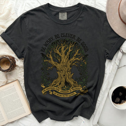 Dark t-shirt with tree graphic and text "BE WARY. BE CLEVER. BE GOOD."