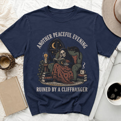 Grim Reaper skeleton reading by candlelight, with text "Another Peaceful Evening Ruined By A Cliffhanger".