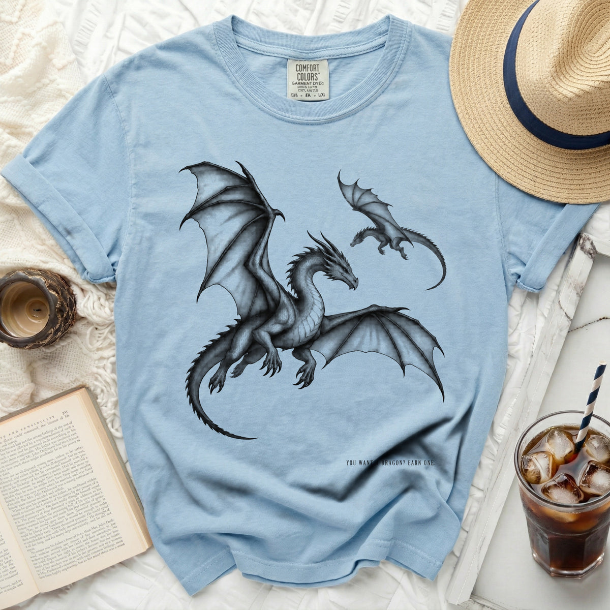 Light blue t-shirt with two dragons and text "YOU WANT A DRAGON? EARN ONE."