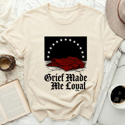 T-shirt with "Grief Made Me Loyal" text and star design.