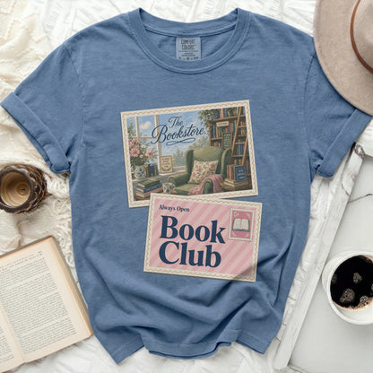 Blue t-shirt with "Book Club" design featuring a vintage bookstore scene.