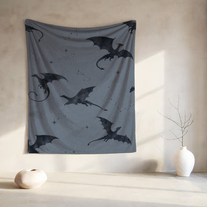 Dark dragon silhouettes on a gray tapestry with faint lattice pattern.