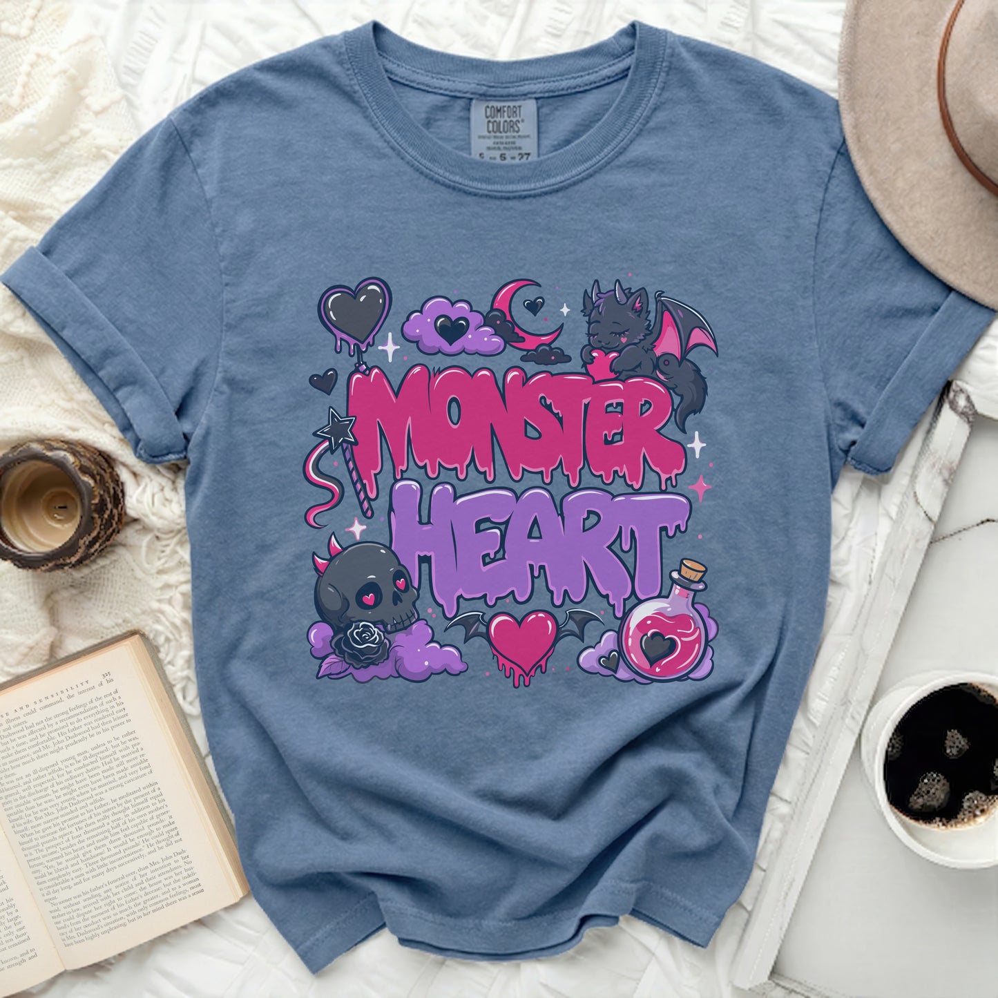 Blue t-shirt with pink Monster Heart graphic and text.