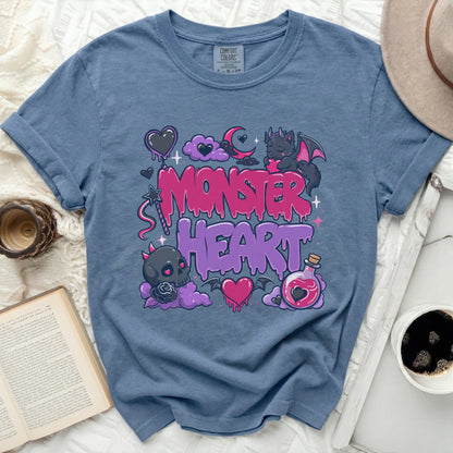 Blue t-shirt with pink Monster Heart graphic and text.