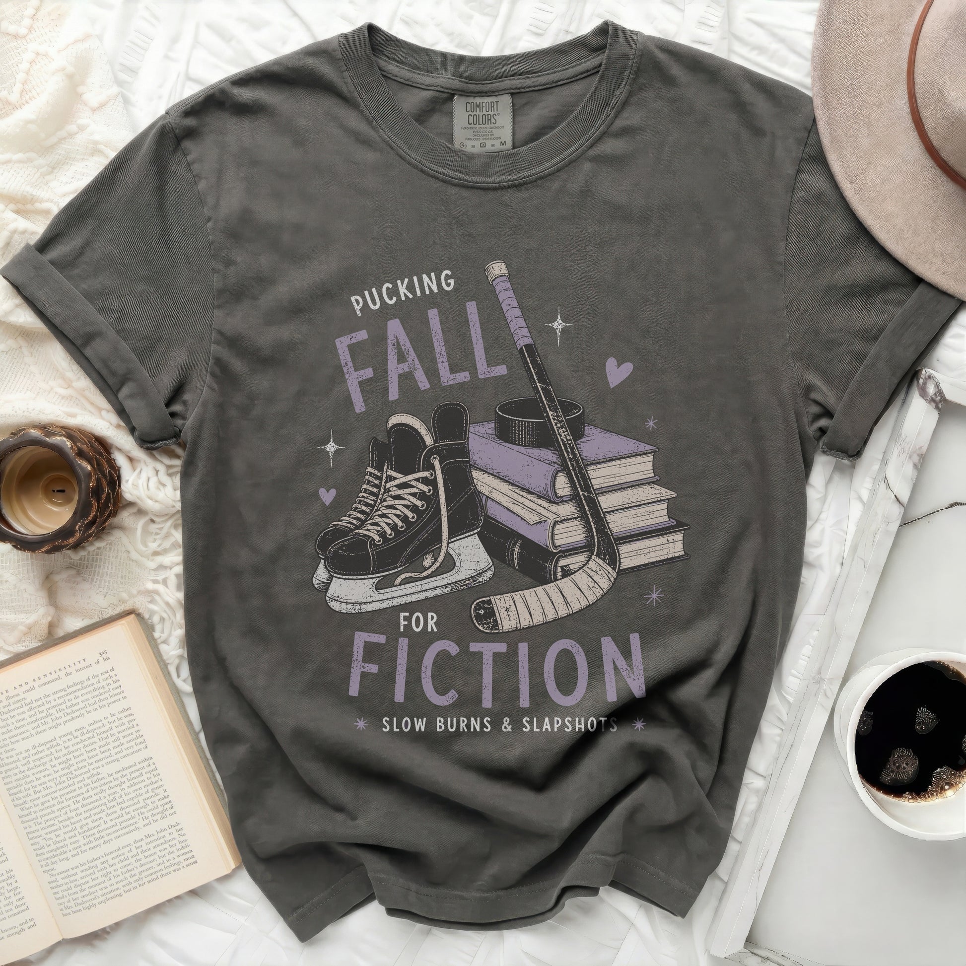 Dark grey t-shirt with "Pucking Fall Fiction" graphic and hockey imagery.