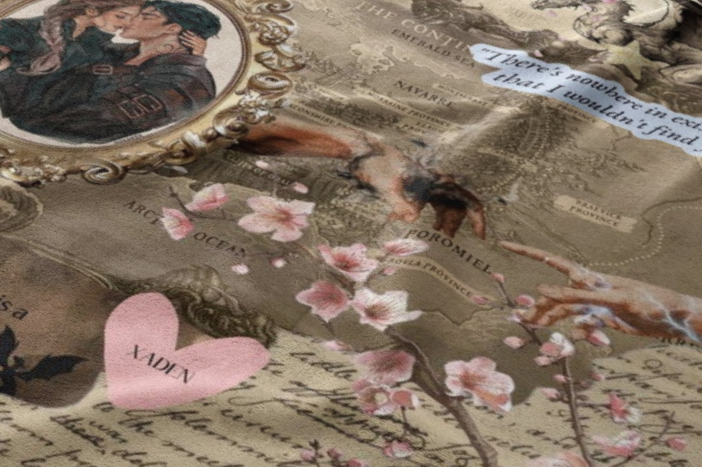Collage fabric with couple kissing, map elements, flowers, and text "XADEN".