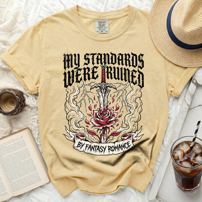 Yellow t-shirt with sword, rose, and text "My Standards Were Ruined By Fantasy Romance."