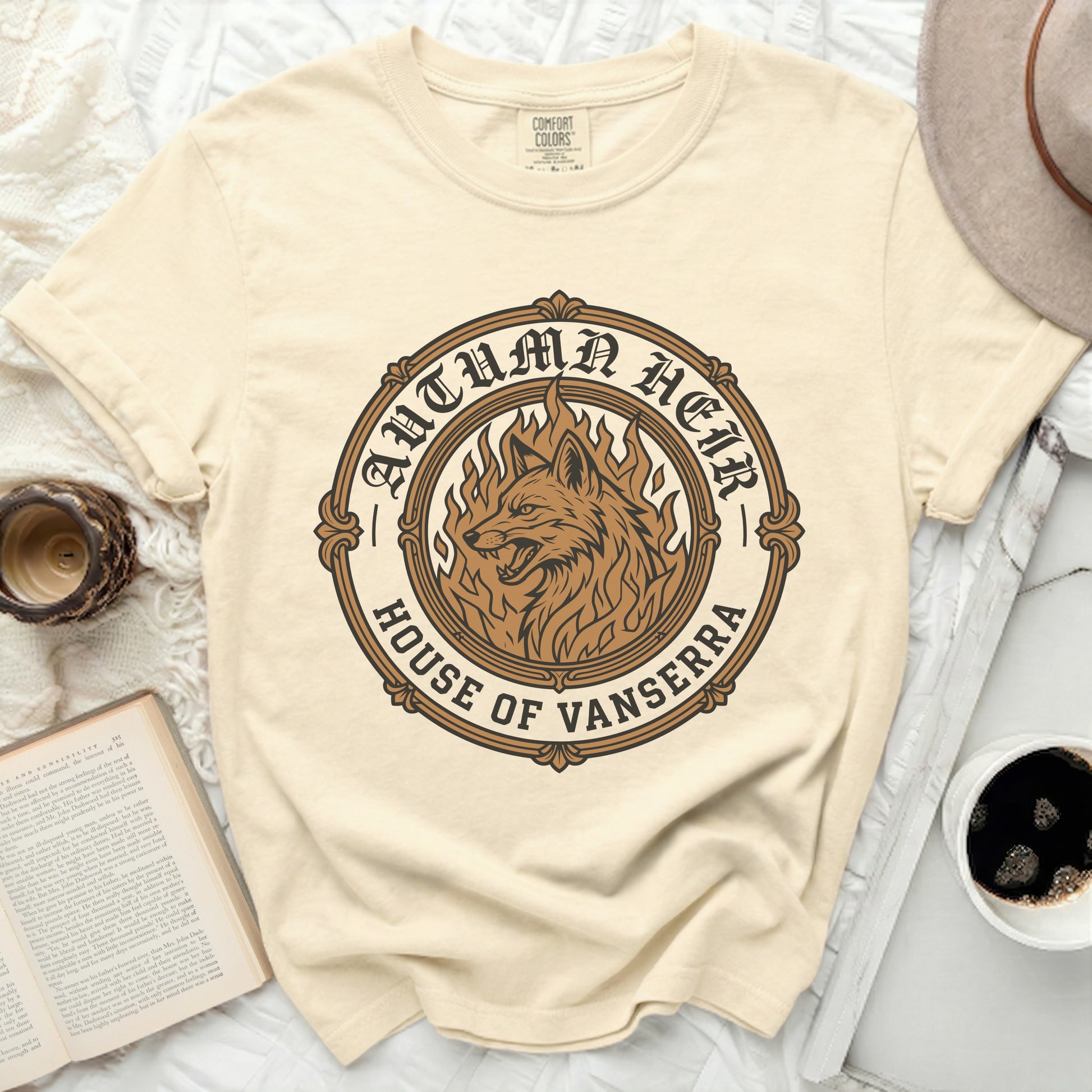 Cream t-shirt with "Autumn Heir House of Vanserra" wolf graphic design.