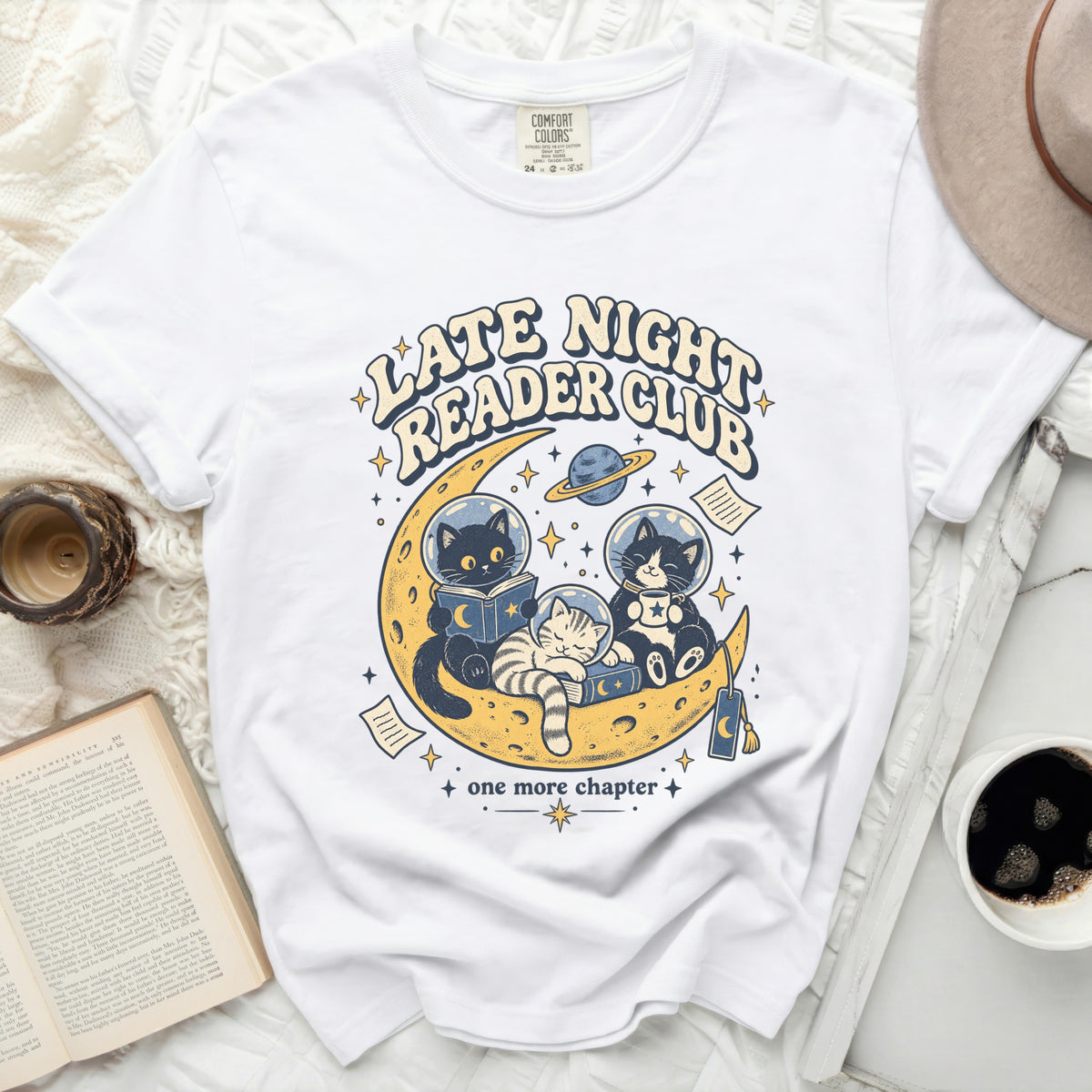 White t-shirt with "Late Night Reader Club" and cats on the moon graphic.