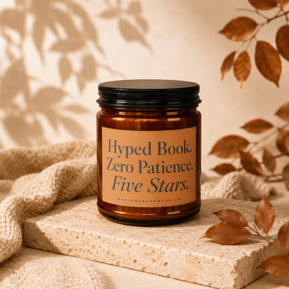 Amber jar candle with black lid reads "Hyped Book. Zero Patience. Five Stars."