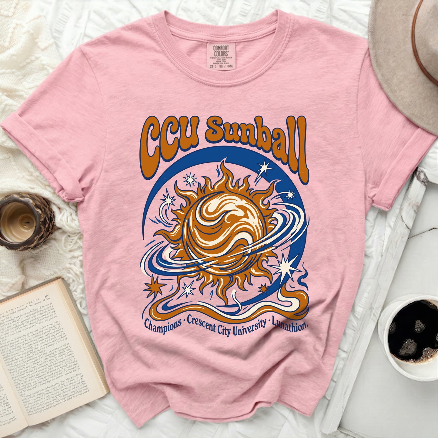 Pink t-shirt with "CCU Sunball" graphic and university text.