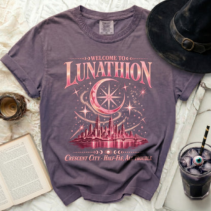 Purple t-shirt with "Welcome to Lunathion Crescent City Half-Fae, All Trouble" graphic.