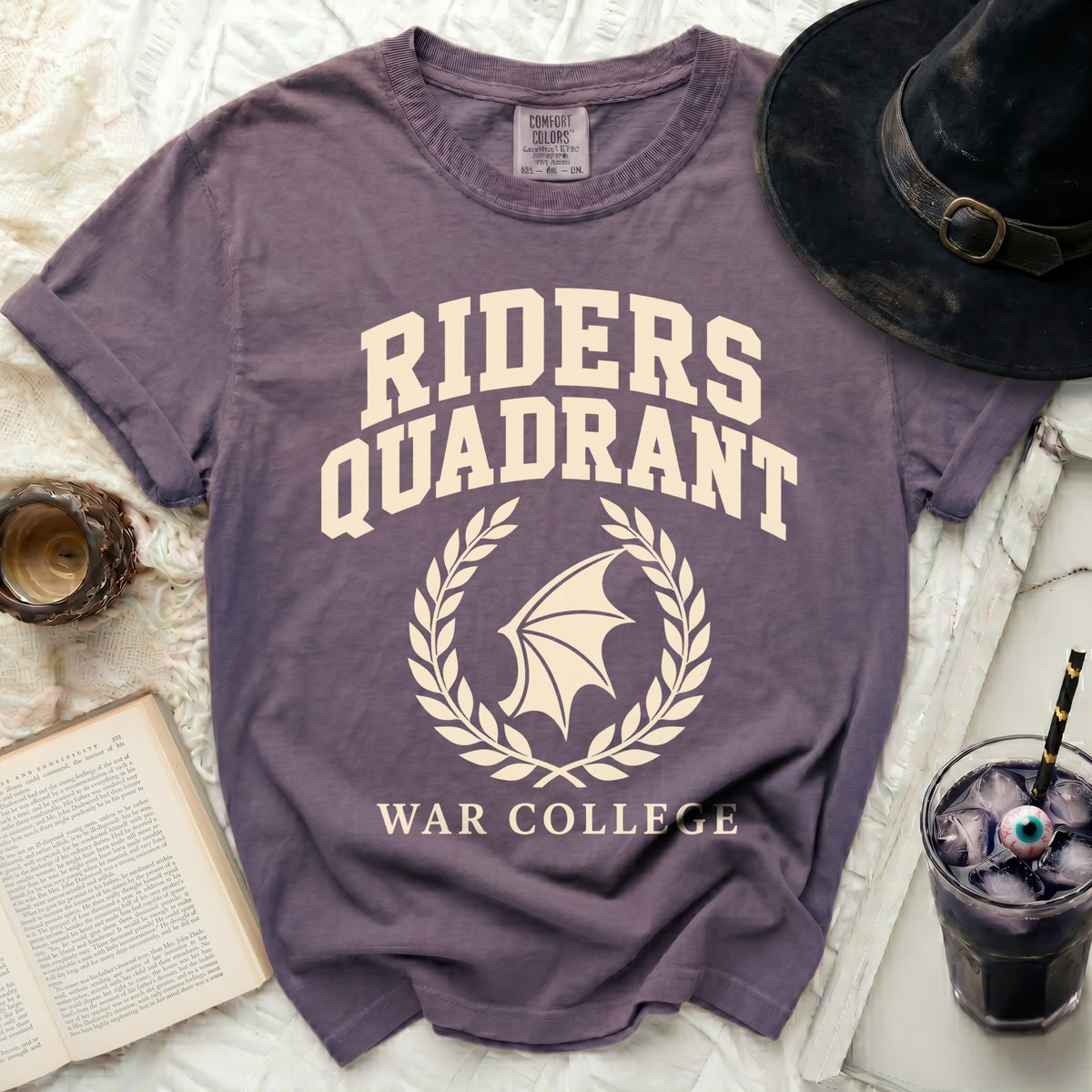 Purple t-shirt with "RIDERS QUADRANT WAR COLLEGE" text and winged emblem.