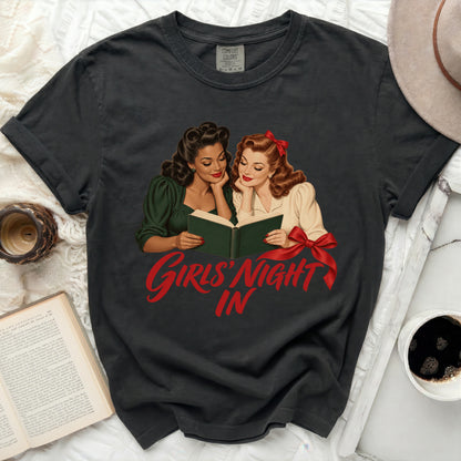 Black t-shirt with graphic of two women reading and "Girls' Night In" text.
