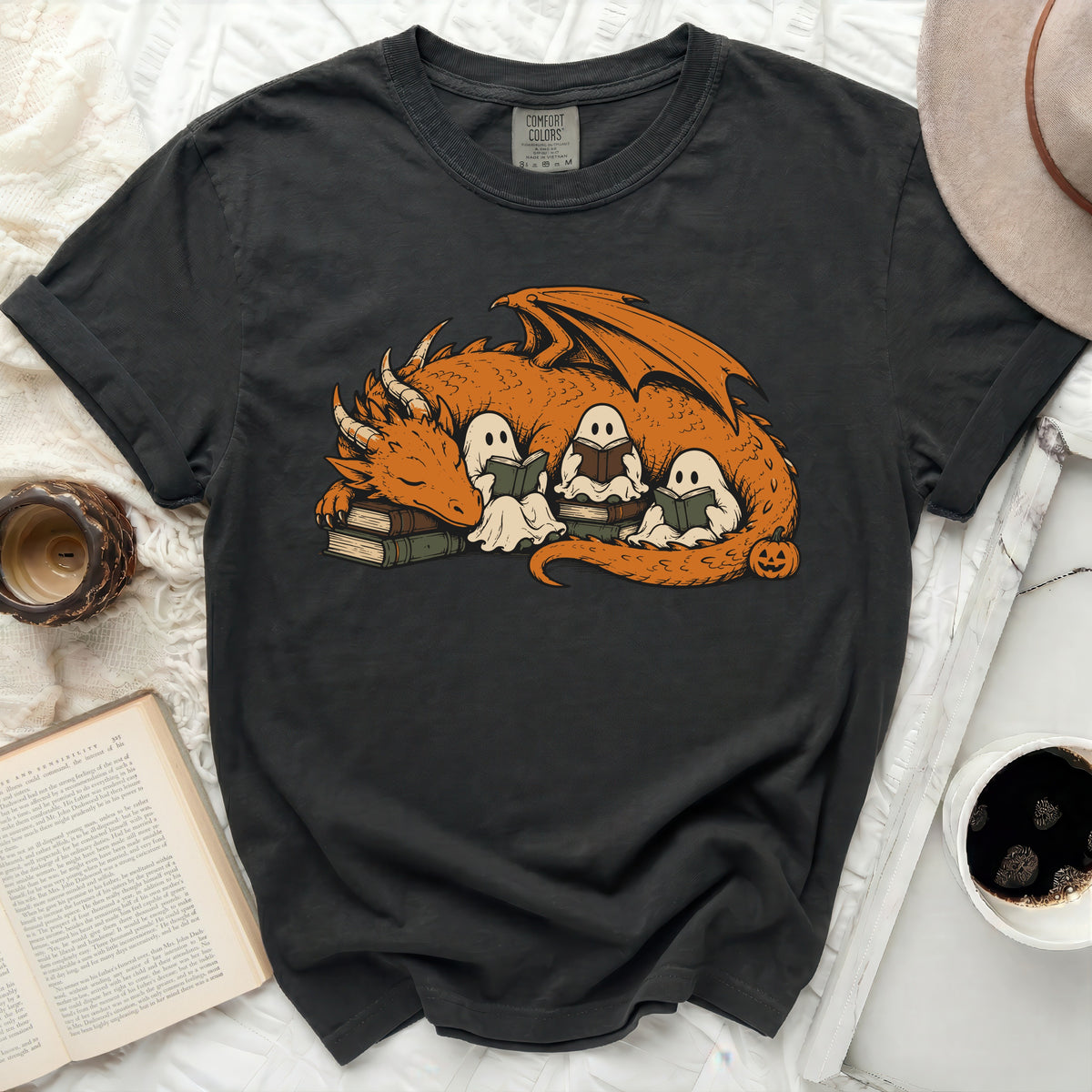 Black t-shirt with a dragon and three ghosts reading books graphic.