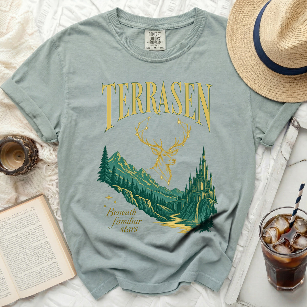 Green t-shirt with "TERRASEN" and a deer, mountains, and castle graphic.